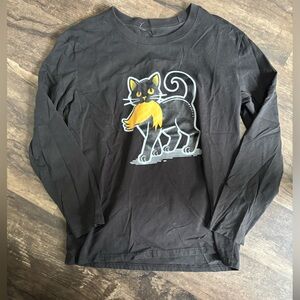 Medium, long sleeve shirt, black cat with Trump’s stupid hair in its mouth